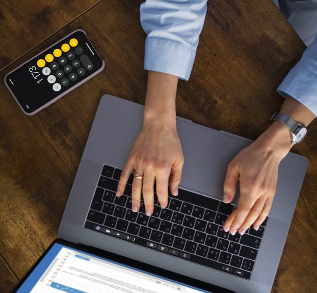 view-woman-typing-laptop